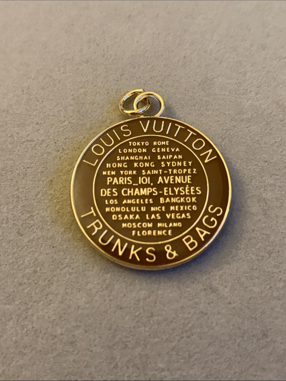 Brown and Gold Round Trunks & Bags Medallion Charm